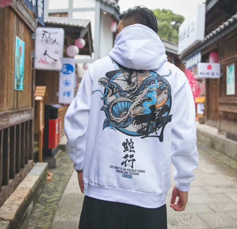 men's streetwear hoodie with Chinese letters displayed against a traditional street backdrop.