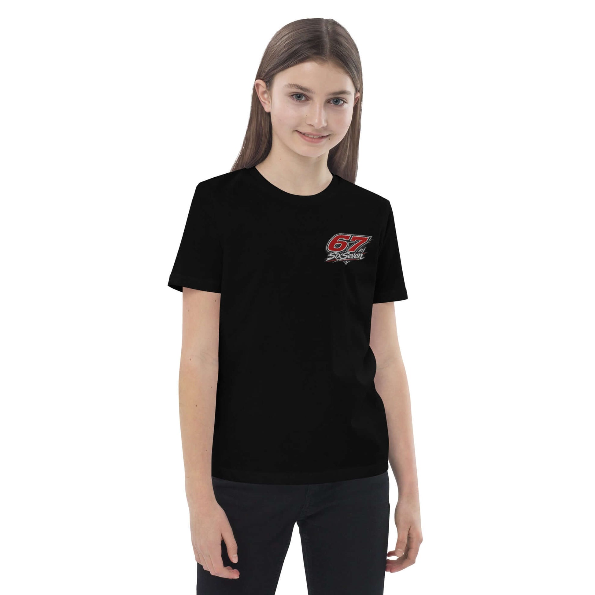 Organic cotton kids t-shirt displayed on a young girl wearing a black shirt with a graphic design.