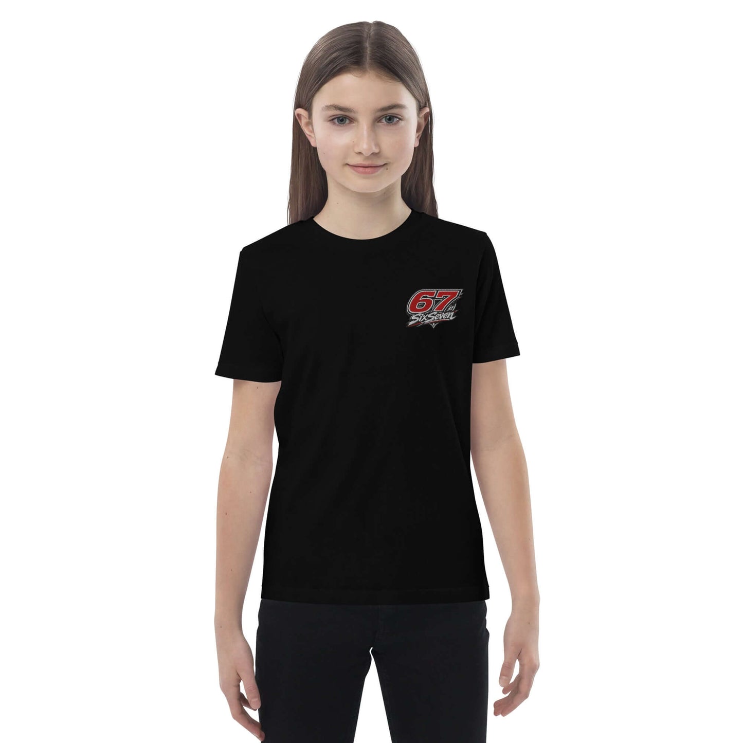 A girl wearing an Organic cotton kids t-shirt in black, featuring a bold red graphic design.
