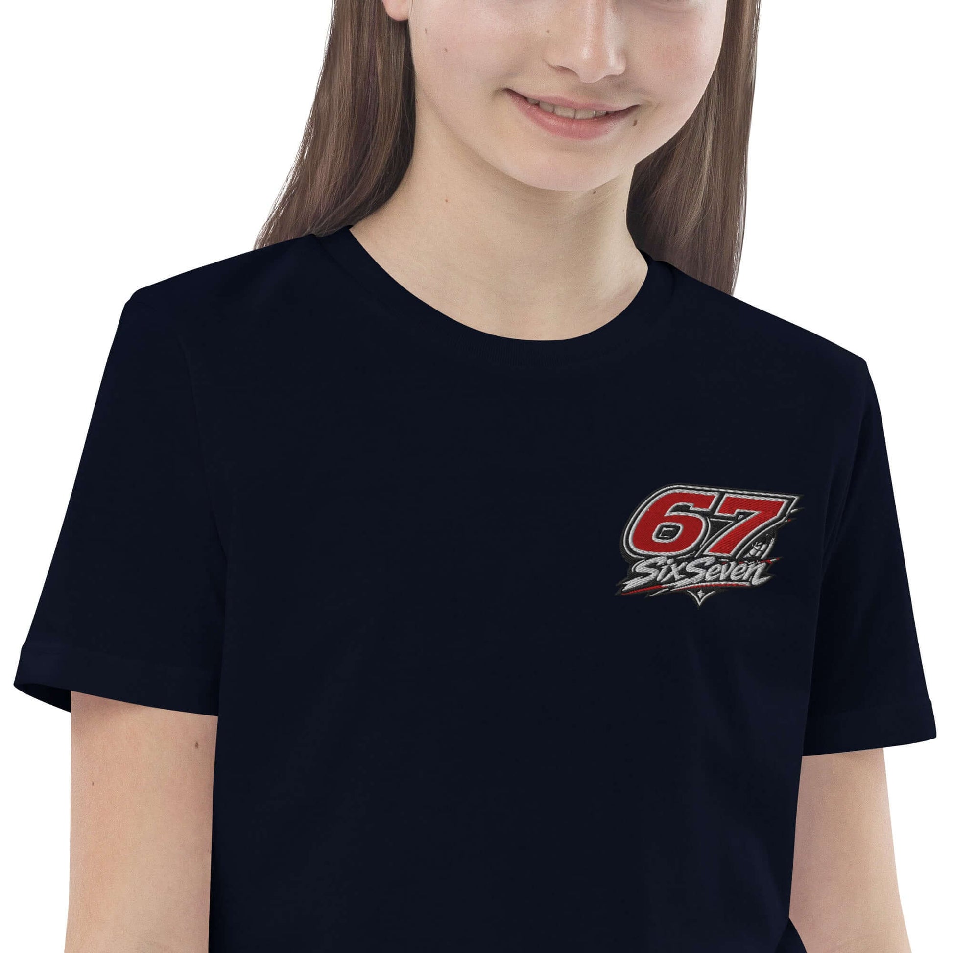 Organic cotton kids t-shirt worn by a girl, featuring a colorful logo on a black background.