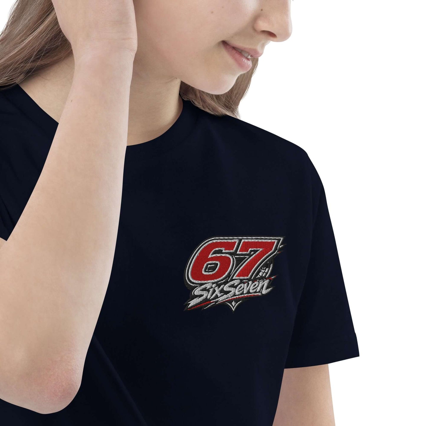 Child wearing a black t-shirt featuring '67 SixSeven' logo, showcasing a stylish and comfortable design.
