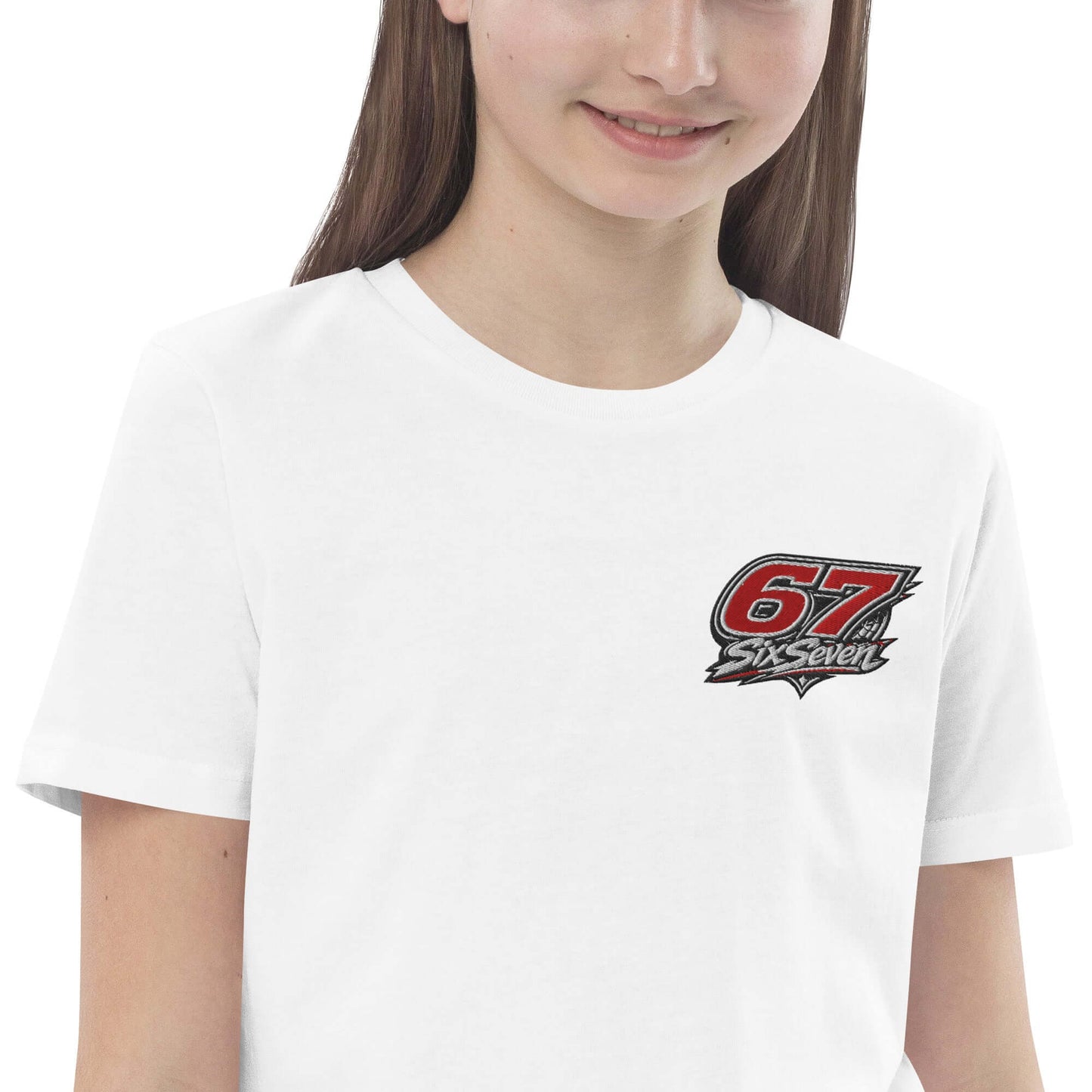 Girl wearing an organic cotton kids t-shirt with a 67 SixSeven logo.