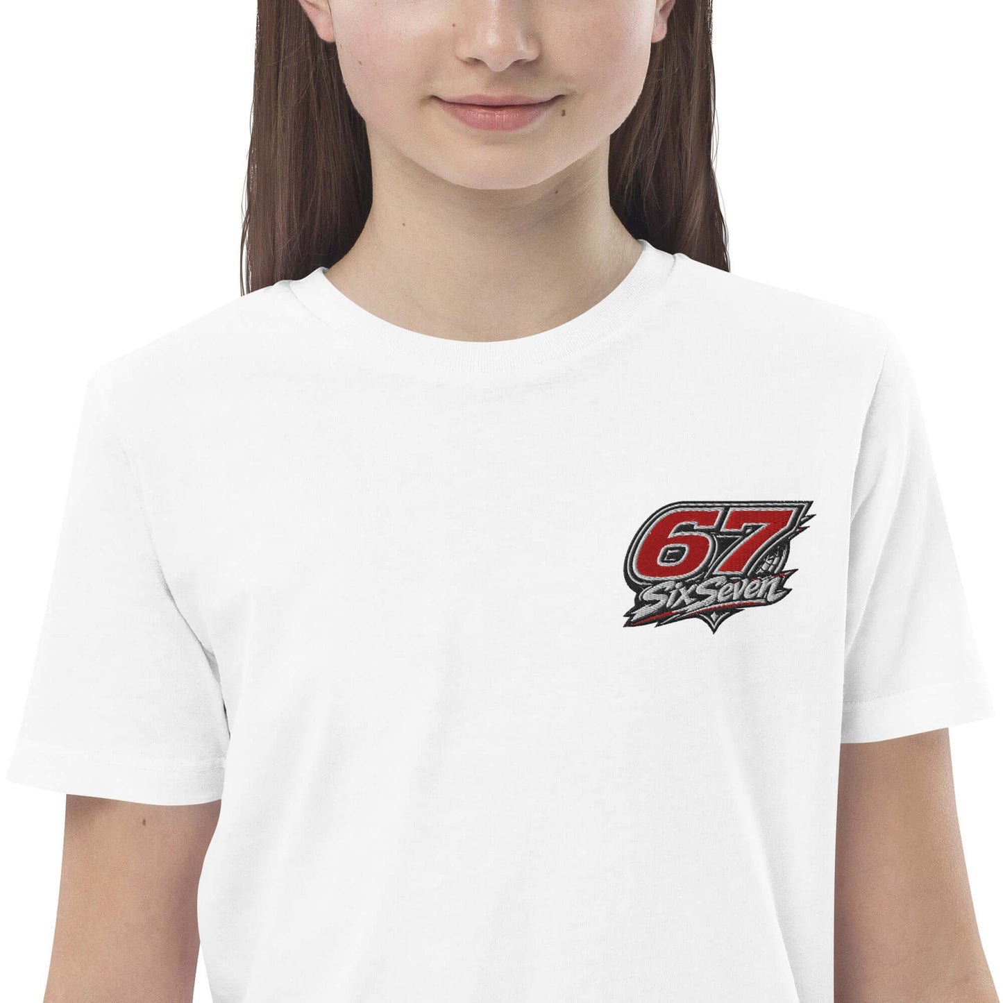 A child wearing an Organic cotton kids t-shirt with a '67 SixSeven' logo.