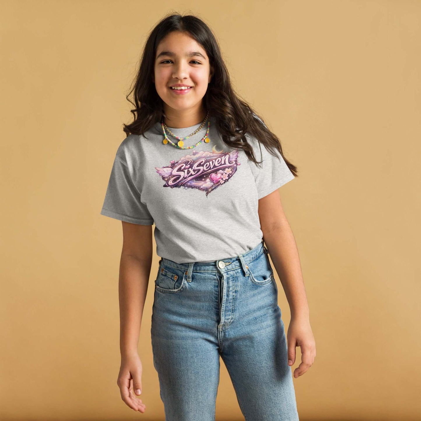 Girl wearing a Youth classic tee in Sport Grey with a colorful graphic design, perfect for casual outings.